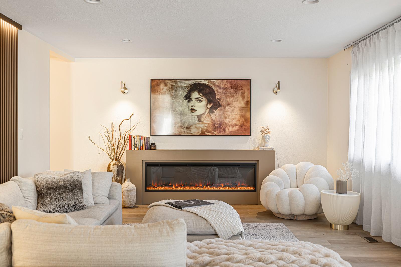 Finished living room with a long fireplace and television